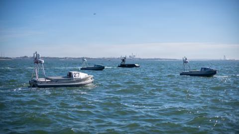 Unmanned surface vessels supported by Naval Surface Warfare Center, Port Hueneme Division (NSWC PHD) prepare for a NATO exercise offshore from the Portuguese Navy Operational Experimentation Center in Troia, Portugal, during the 2025 Robotic Experimentation and Prototyping with Maritime Unmanned Systems exercise, known as REPMUS, on Sept. 24. (U.S. Navy photo by Eric Parsons)