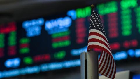 An American flag is displayed on a desk on the floor of the New York Stock Exchange (NYSE) at the opening bell on July 15, 2025, in New York City. (Getty Images)