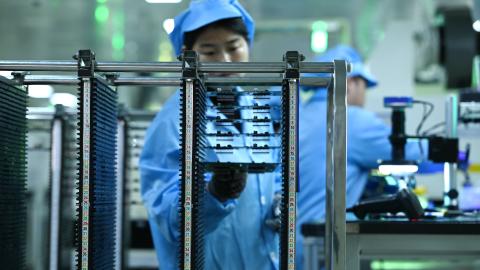 An engineer tests the quality of chips for a steering controller at a workshop on March 5, 2026, in Yiwu, China. (Getty Images)