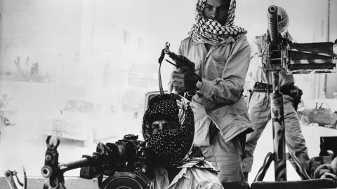 Palestinian guerillas patrol the streets of Amman in a heavily armed jeep. (Getty Images)