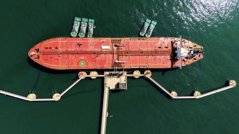 An oil tanker is docked unloading crude oil at the port in Qingdao, in China's eastern Shandong province, on April 7, 2026. (Photo by CN-STR / AFP via Getty Images)