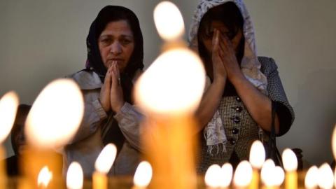 Women attend a religious service at the cathedral in Etchmiadzin, outside Yerevan, on April 23, 2015. (KIRILL KUDRYAVTSEV/AFP/Getty Images)​