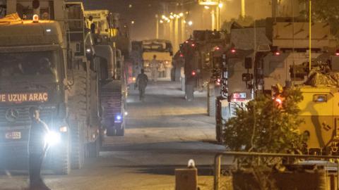 Turkish army soldiers drive towards the border with Syria near Akcakale in Sanliurfa province on October 8, 2019. (AFP/Getty Images)
