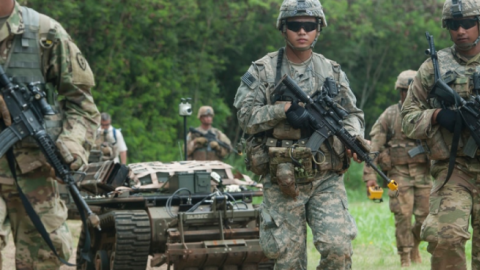 U.S. soldiers move in formation while controlling unmanned vehicles as part of an exercise in 2016 at Marine Corps Training Area Bellows, Hawaii. (Staff Sgt. Christopher Hubenthal/U.S. Air Force)