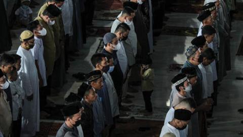 Acehnese Muslims are seen attending Eid al-Fitr prayer which marks the end of the holy month of Ramadan at the Islamic Center Mosque in Lhokseumawe, on May 13, 2021, Aceh Province, Indonesia. (Photo by Fachrul Reza/NurPhoto via Getty Images)