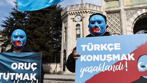 People gather for an exhibition called "Not a joke, a genocide" to raise awareness against China's policies and human rights violations towards Uyghurs in Istanbul, Turkey on March 14, 2021. (Photo by Onur Coban/Anadolu Agency via Getty Images)