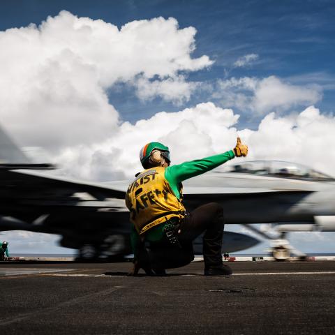 A U.S. Sailor signals the launch of an F/A-18F Super Hornet aircraft, attached to Strike Fighter Squadron 213, on the flight deck of the world’s largest aircraft carrier, Ford-class aircraft carrier USS Gerald R. Ford (CVN 78), while underway in the Caribbean Sea, Jan. 30, 2026. U.S. military forces are deployed to the Caribbean in support of the U.S. Southern Command mission, Department of War-directed operations, and the president’s priorities to disrupt illicit drug trafficking and protect the homeland. 