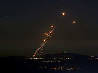 Rockets fired from southern Lebanon are intercepted by Israel's Iron Dome air defence in northern Israel on September 27, 2024. (Jalaa Marey/AFP via Getty Images)