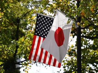 The Japanese and US flags fly outside the Akasaka Palace in Tokyo on October 28, 2025. (Getty Images)