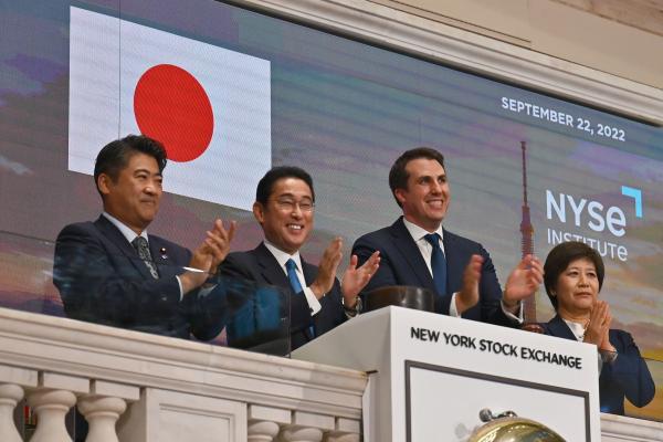 Fumio Kishida (2L), Prime Minister of Japan, stands with John Tuttle (2R), Vice Chairman of the NYSE Group before ringing in the closing bell at the New York Stock Exchange (NYSE) in New York City