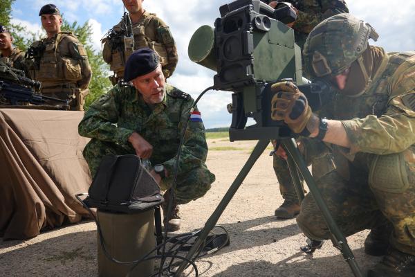 Admiral Rob Bauer, chair of the Military Committee of NATO, inspects the equipment of members of the German-French Brigade on July 10, 2023, in Gaiziunai, Lithuania. (Photo by Tim Ireland/Getty Images)