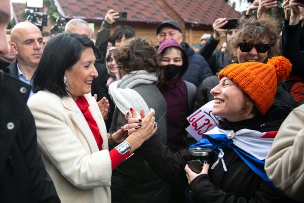 President Salome Zourabichvili greets a supporter outside her residence in Tbilisi, following the inauguration of the newly elected president, Mikheil Kavelashvili.  (Photo by Jay Kogler/SOPA Images/LightRocket via Getty Images)