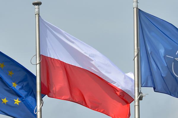 A view of EU, Polish and NATO flags at the Presidential Palace in Warsaw, June 21, 2016 (Artur Widak/NurPhoto via Getty Images)