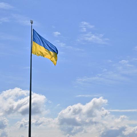 This photograph showsthe Ukrainian flag and the Motherland Monument (R) in Kyiv on August 23, 2025, a day before the Independence Day of Ukraine, amid Russian invasion in Ukraine. (Photo by Sergei SUPINSKY / AFP) (Photo by SERGEI SUPINSKY/AFP via Getty Images)