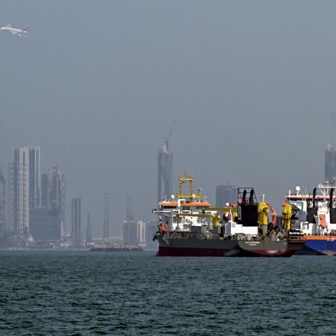 Commercial vessels are pictured offshore in Dubai on March 11, 2026. New attacks hit three commercial ships in the Gulf on March 11, with one of the vessels in flames as Iran pressed its campaign against its oil-exporting neighbours, threatening shipping in the Strait of Hormuz and plunging the global energy economy into crisis. (Photo by AFP via Getty Images) / Attention editors: AFP covers the war in the Middle East through its extensive regional network, including bureaus in Tehran, Jerusalem and several
