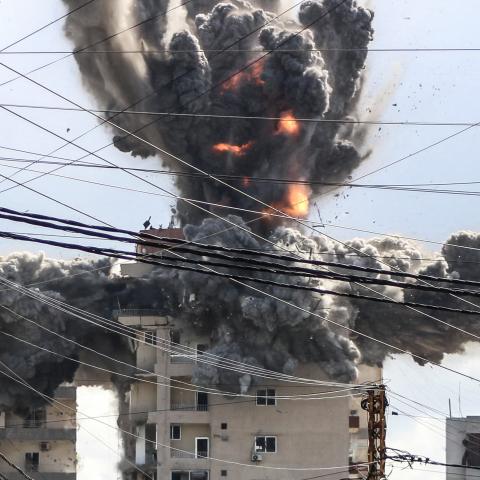 A fireball rises from a building hit by an Israeli airstrike in the area of Abbasiyeh, on the outskirts of the southern Lebanese city of Tyre, on April 8, 2026. Lebanon's army warned people against returning to the country's south on April 8, where the Israeli military is still launching attacks, as Israel said the ceasefire with Iran did not include its conflict with Hezbollah. (Photo by Kawnat HAJU / AFP via Getty Images)